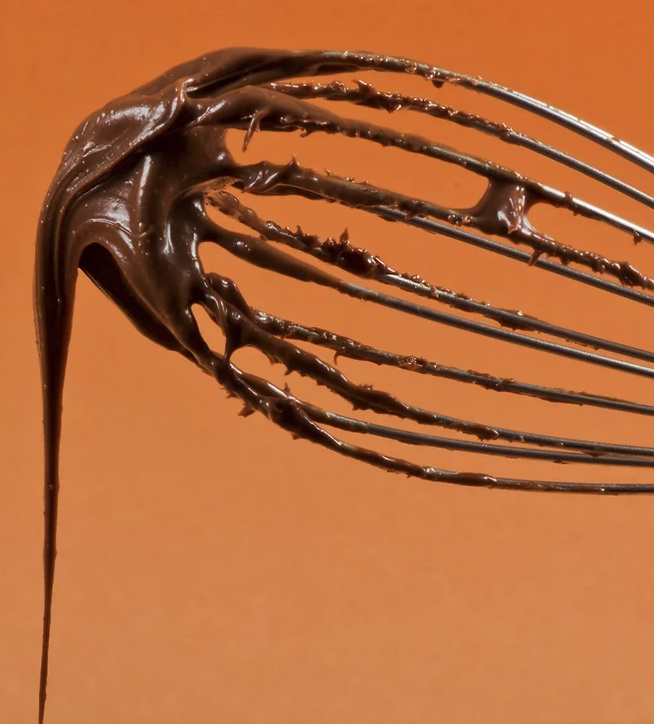Whisk with chocolate dripping off courtesy of Dan Donuts in Big Bear, California